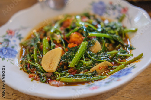 Kangkung Balacan. Water Spinach Stir-fry the shrimp paste. Indonesian special foodand vegetables. Indonesian traditional food. Healthy food. Food Concept photo