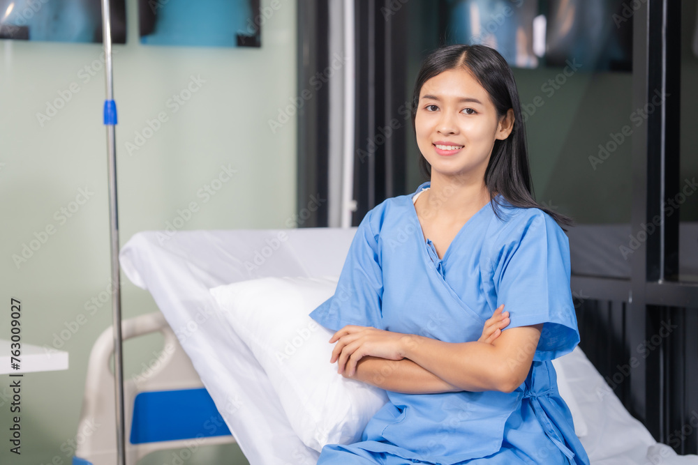 Young Asian female patient lying in hospital bed. Health check. Woman recovering after successful surgery. Young Asian female patient lying in hospital bed. Health check. Woman recovering after successful surgery.