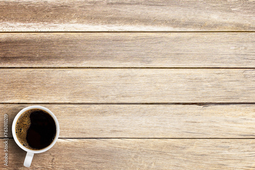 Cup of coffee on a office desk or wood table background.