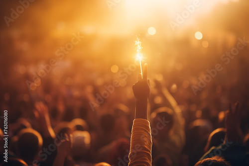 Passionate crowd at a concert with raised hands and Bengal lights, radiating energy and excitement, capturing the electrifying atmosphere of live music performances and shared euphoria