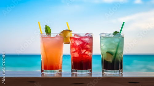 Beautiful three colorful summer drinks on the table ag