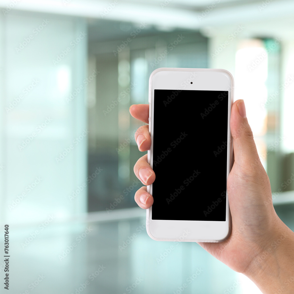 Hand is holding a modern touch screen phone. Hand is holding a modern touch screen phone.