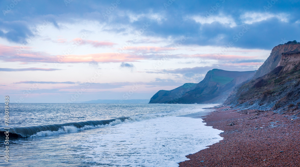 Dawn at Eype beach on the Dorset Jurassic coast south west England UK