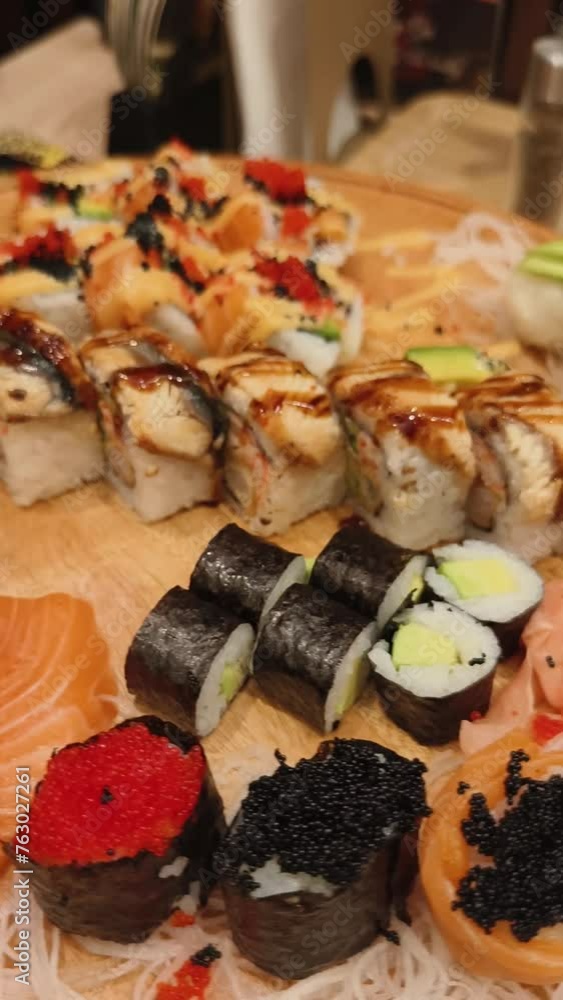 Asian restaurant, sushi on the table, close-up shot of various Japanese dishes Asian restaurant, sushi on the table, close-up shot of various Japanese dishes