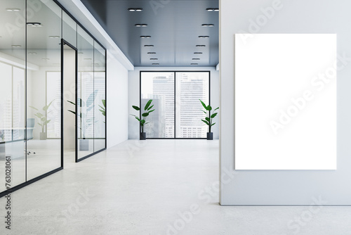 Modern glass office corridor interior with blank white mock up poster on wall, concrete flooring, window with city view and reflections. 3D Rendering.