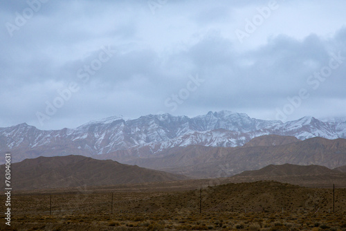 Hainan Mongolian and Tibetan Autonomous Prefecture, Qinghai Province-Grasslands and roads under the snow-capped mountains