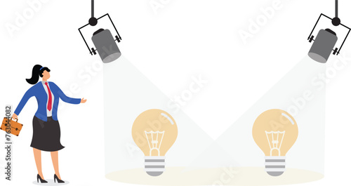 Businesswoman with spotlight and spotlit idea light bulb