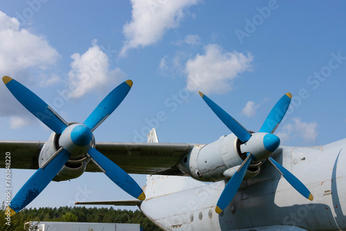 Wing and propellers of a civilian old aircraft.