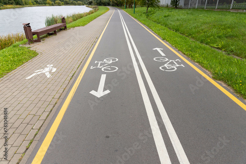 Bicycle and footpaths and white bicycle symbol.