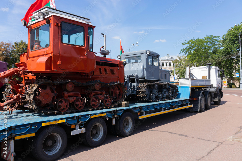 Old tractor bulldozer on a car platform. Old tractor bulldozer on a car platform.