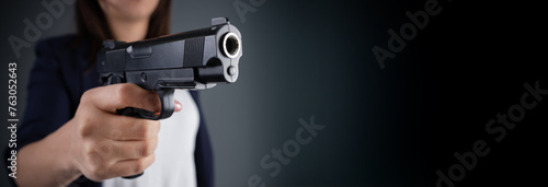 Fierce Determination: Close-Up of Girl Holding a Gun