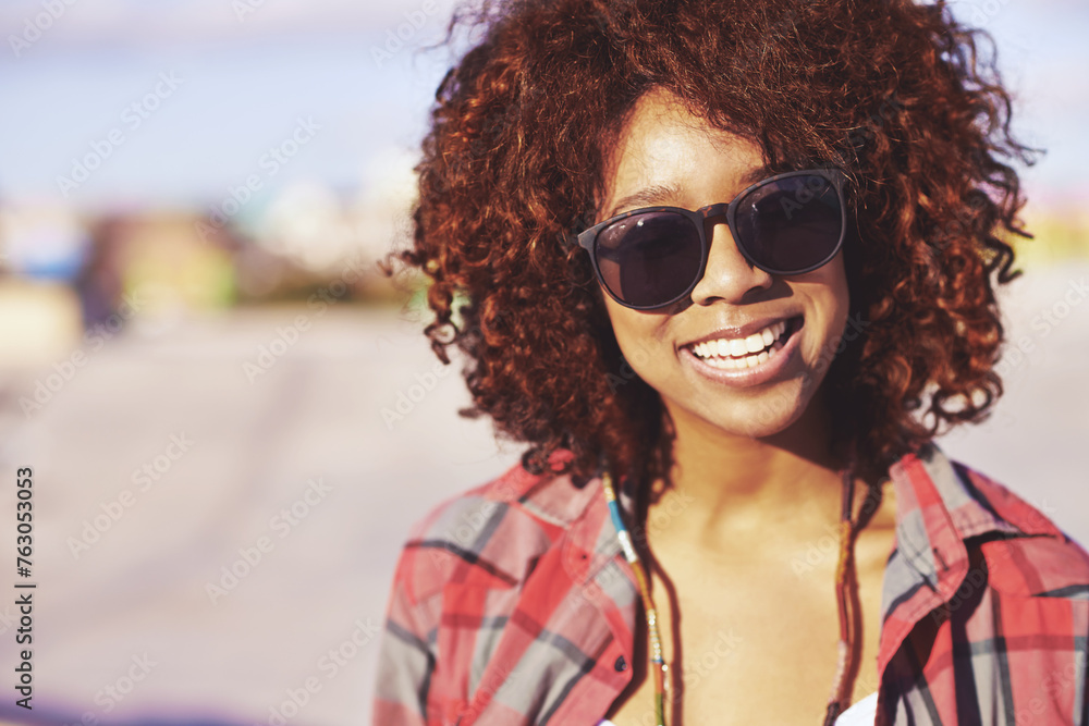Face, black woman and smile with sunglasses at skatepark or outdoor with happiness, leisure and break in Atlanta. Closeup, female person and skater with hobby or activity for training, fun and relax