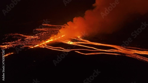 Large fissure volcanic eruption in Iceland during night, aerial photo