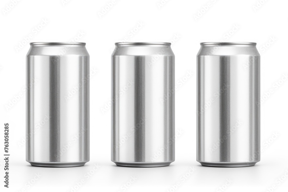 Three cans of soda placed on a white table. Perfect for food and beverage advertising Three cans of soda placed on a white table. Perfect for food and beverage advertising