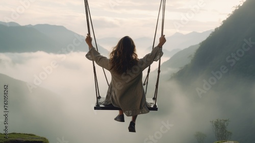 A woman sitting on a swing in mid-air. Suitable for various concepts and designs