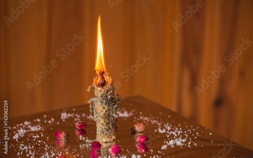 Candle burns on the altar, magic among candles, clean negative energy and any programs, wicca concept	