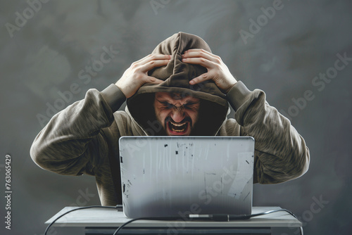 Angry hacker man in hoodie suit is screaming because he failed to hack the security system