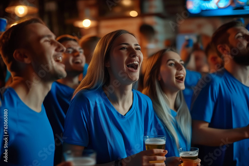 United in Blue: Soccer Fans' Joyful Watch Party at the Pub