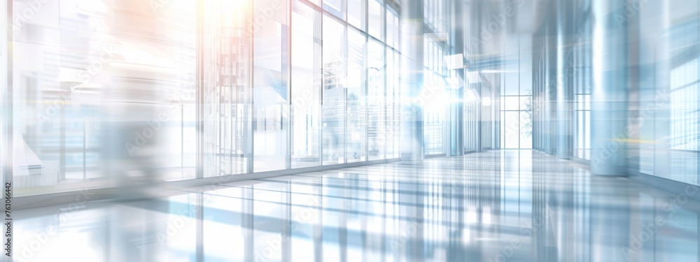 Light blurred background. The hall of an office or medical institution with panoramic windows and a perspective. Light blurred background. The hall of an office or medical institution with panoramic windows and a perspective.