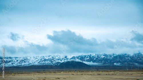 Hainan Mongolian and Tibetan Autonomous Prefecture  Qinghai Province-Grasslands and roads under the snow-capped mountains