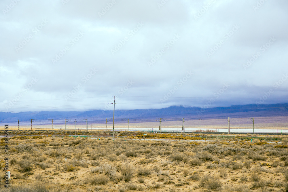 Hainan Mongolian and Tibetan Autonomous Prefecture, Qinghai Province-Grasslands and roads under the snow-capped mountains Hainan Mongolian and Tibetan Autonomous Prefecture, Qinghai Province-Grasslands and roads under the snow-capped mountains