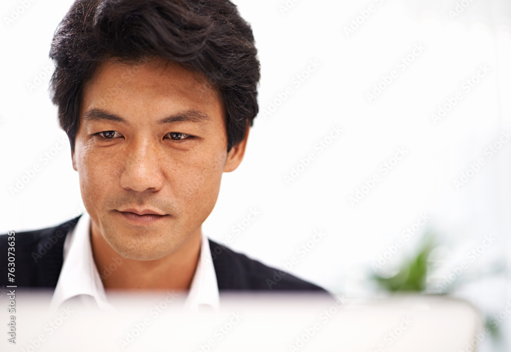 Serious, businessman and employee working on tech in office of IT company with connection to internet. Adult, guy and male person in corporate, professional and online with concentration for project Serious, businessman and employee working on tech in office of IT company with connection to internet. Adult, guy and male person in corporate, professional and online with concentration for project