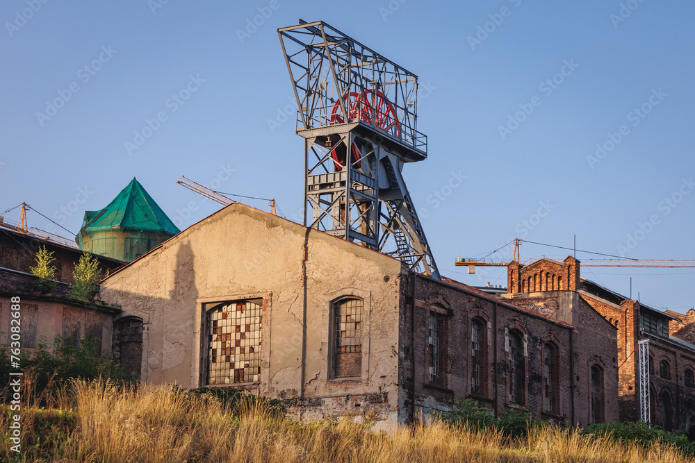 Old shaft tower and buildings of former coal mine in Katowice, Poland Old shaft tower and buildings of former coal mine in Katowice, Poland