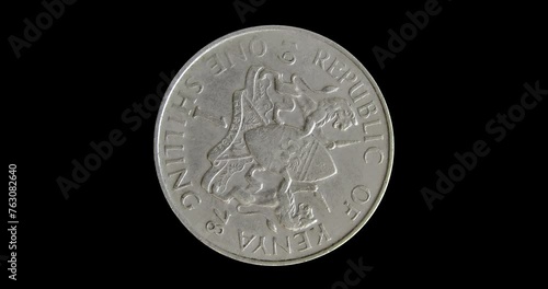 Reverse of Kenya coin 1 shilling 1978, isolated in black background. Seamless animation in 4k resolution video.