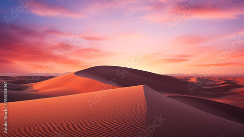 Desert under a vibrant sunset sky  capturing the serene and untouched beauty of the landscape