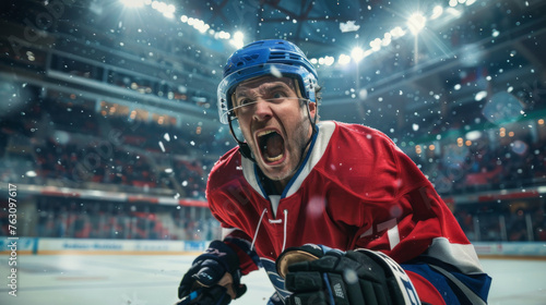 A hockey player exudes shouts of joy amidst the hockey stadium's ambiance, celebrating victory with intense emotions after winning the game, clad in a red hockey jersey. photo