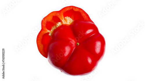 Red sweet bell pepper in hand isolated on a white background. Woman holding bulgarian pepper.Chopped pepper. Half of pepper.