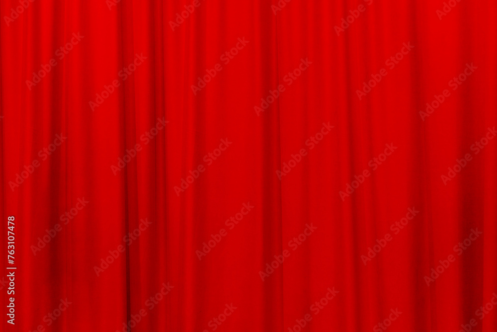 Red theater curtain that dropped down as a straight line. Background for inserting text, empty spaces.