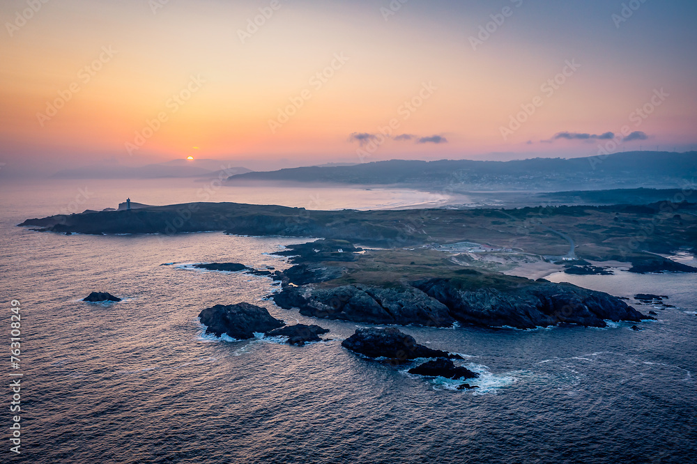 Naklejka premium Aerial View Over Faro de Punta Frouxeira, Valdoviño, Galicia, Province of A Coruña, Spain