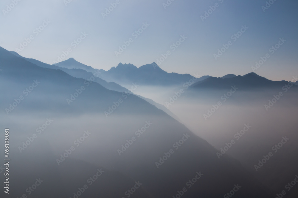 Spectacular mountain ranges silhouettes in shade of grey.