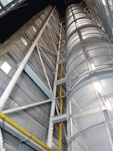 Cylindrical metal structure in an industrial environment