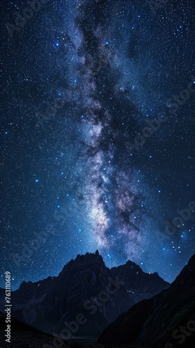 Starry night sky over mountain peaks