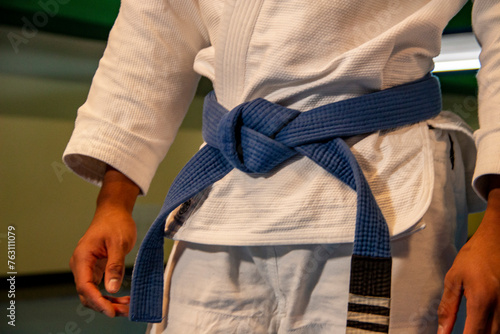 martial arts in this case jiu jitsu where you can see details of the kimono, blue belt, sweeps, grips... photo