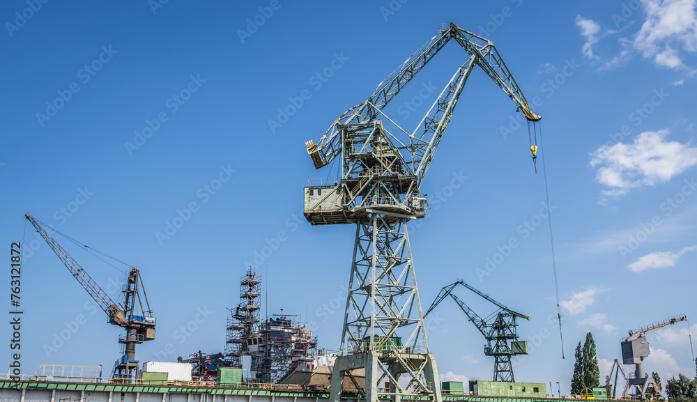 Cranes in area of Gdansk Shipyard in Gdansk city, Poland Cranes in area of Gdansk Shipyard in Gdansk city, Poland