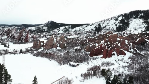 Roxborogh State Park Golf Course aerial drone Colorado Front Range after winter spring deep powder fresh snow on dramatic sharp red rocks mountain landscape Littleton Denver upward motion photo