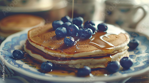 Plate of delicious pancakes with fresh blueberry and syrup