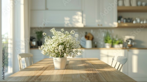 Warm sunlight on a rustic wooden table with a fresh bouquet in a bright kitchen