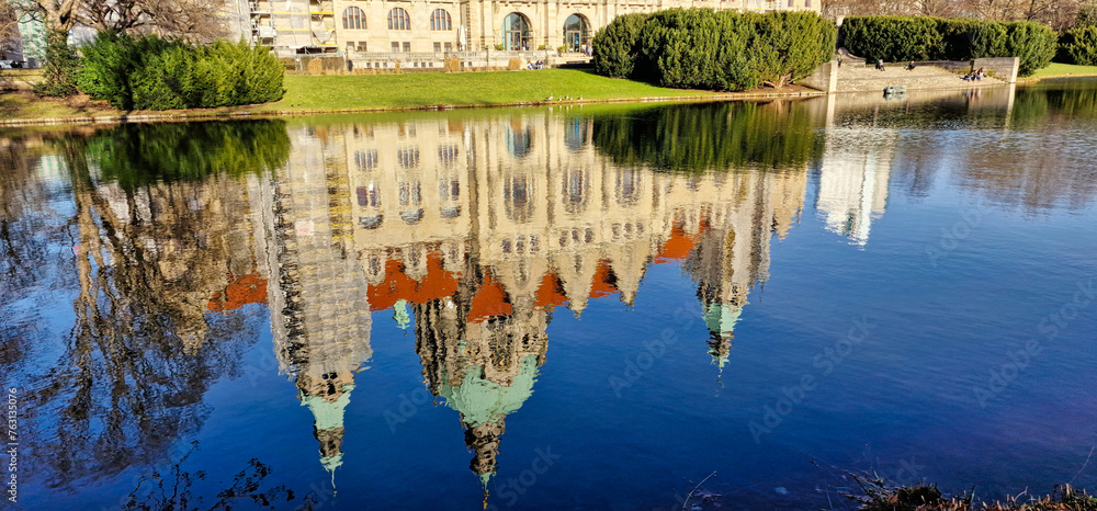 Hanover Maschpark new town hall with beautiful tree reflection in the lake water