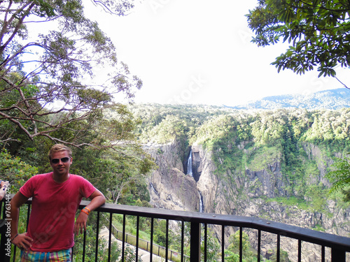 Barron Falls viewing platform with German blonde man in colorful shorts and pink t-shirt Australia photo