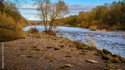 Riverside View of River Tyne at Wylam, located in Northumberland on the tree-lined riverbanks of the Tyne Valley