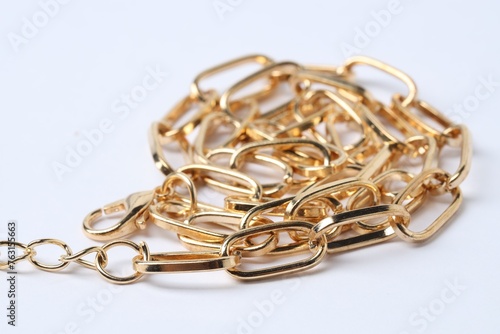 One metal chain on white background, closeup. Luxury jewelry
