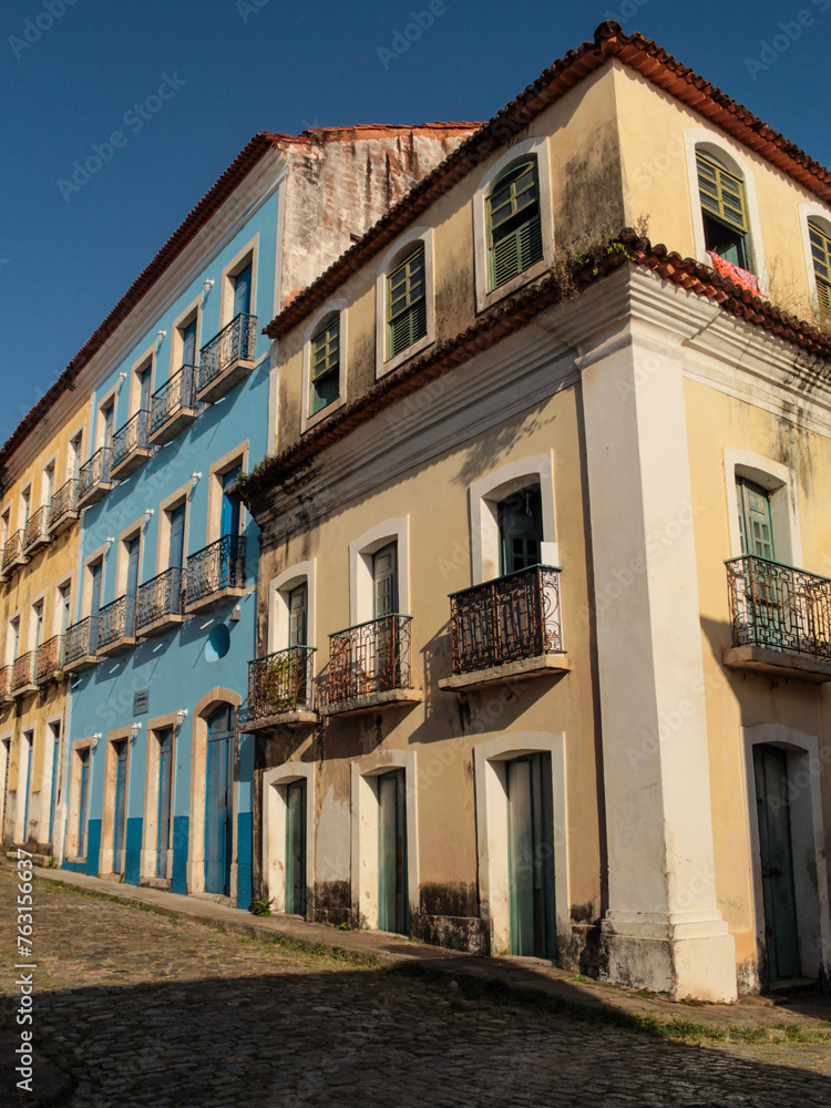 Facades of some old buildings, on a street paved with cobblestones, in the historic center of São Luís MA, Brazil.