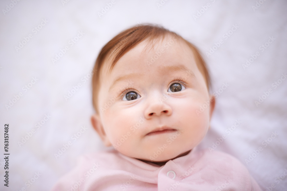 Baby, bed and girl in nursery with curiosity for childhood development, growth and relax in house. Newborn, ginger and kid with wonder for knowledge, wellness and calm child at home from above Baby, bed and girl in nursery with curiosity for childhood development, growth and relax in house. Newborn, ginger and kid with wonder for knowledge, wellness and calm child at home from above