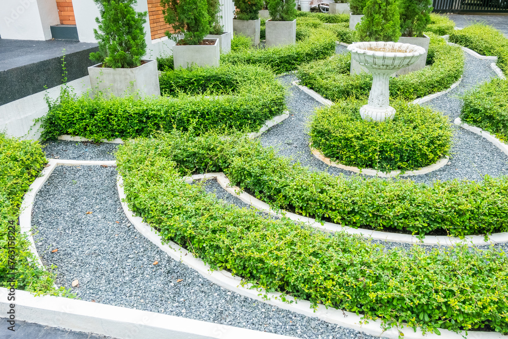 Classical English style garden with Green bushes circular labyrinth in spring garden,English country garden,English Village Cottage. Classical English style garden with Green bushes circular labyrinth in spring garden,English country garden,English Village Cottage.
