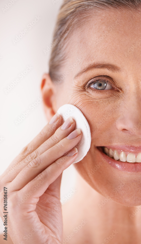 Mature woman, portrait and cotton for skincare in studio with facial cleansing, cosmetics or skin treatment. Model, person or swab for face detox, makeup removal or natural beauty on white background Mature woman, portrait and cotton for skincare in studio with facial cleansing, cosmetics or skin treatment. Model, person or swab for face detox, makeup removal or natural beauty on white background