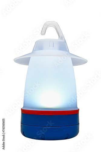 Modern plastic camping light illuminated and isolated